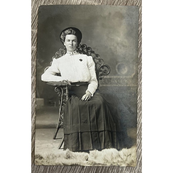 Postcard RPPC Staged Elegant Victorian Woman Seated on Wicker Chair Fur Rug - Picture 1 of 3